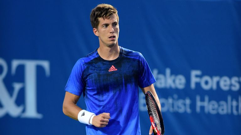 Aljaz Bedene of Great Britain reacts after a point against Gilles Simon of France during the Winston-Salem Open