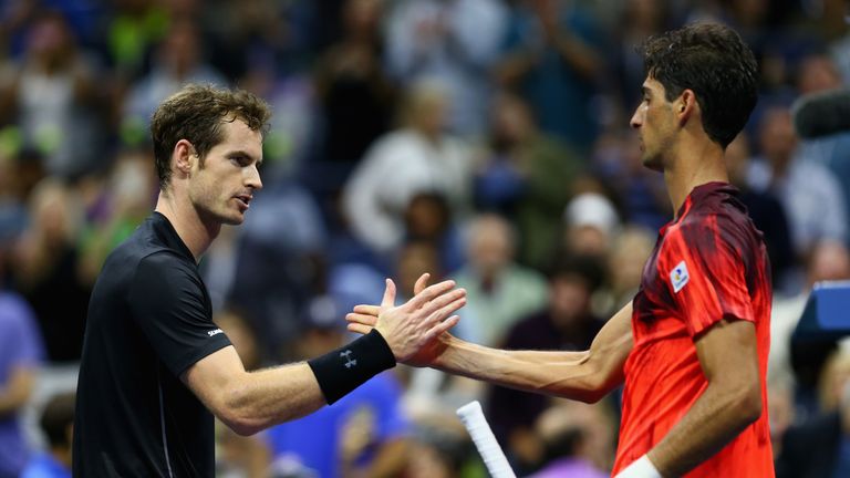 Andy Murray of Great Britain shakes hands at the net after his straight sets victory against Thomaz Bellucci of Brazil at the US Open