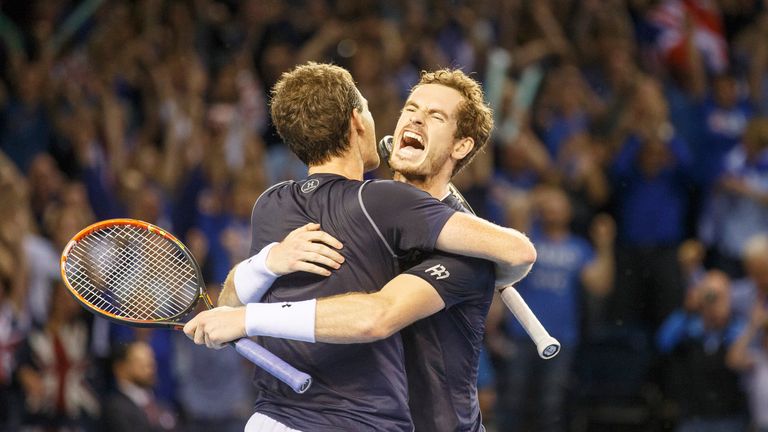 Andy Murray celebrates with his brother Jamie as they beat Lleyton Hewitt and Sam Groth of Australia