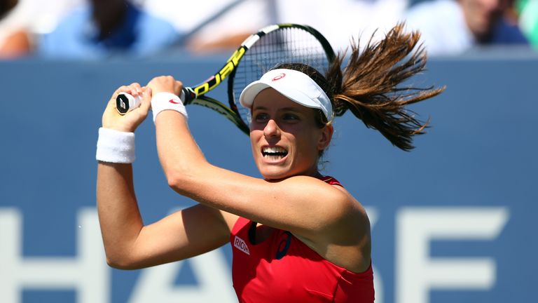 Johanna Konta of Great Britain returns a shot against Andrea Petkovic of Germany at the US Open