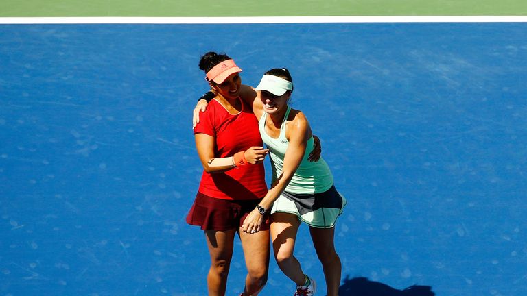 Martina Hingis (right) of Switzerland and Sania Mirza (left) of India celebrate after winning the US Open doubles