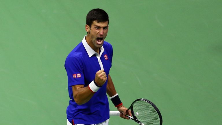 Novak Djokovic celebrates a point against Roger Federer during their Men's Singles Final