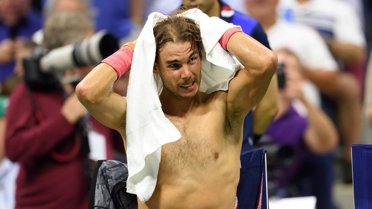 Rafa Nadal of Spain towels off during a break while playing Fabio Fognini of Italy during the 2015 US Open