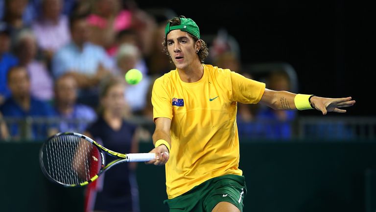 Thanasi Kokkinakis of Australia hits a return during Day One of the Davis Cup Semi Final match between Great Britain an