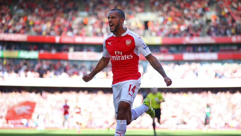 Theo Walcott of Arsenal celebrates scoring the opening goal during the Barclays Premier League match between Arsenal and Stoke City