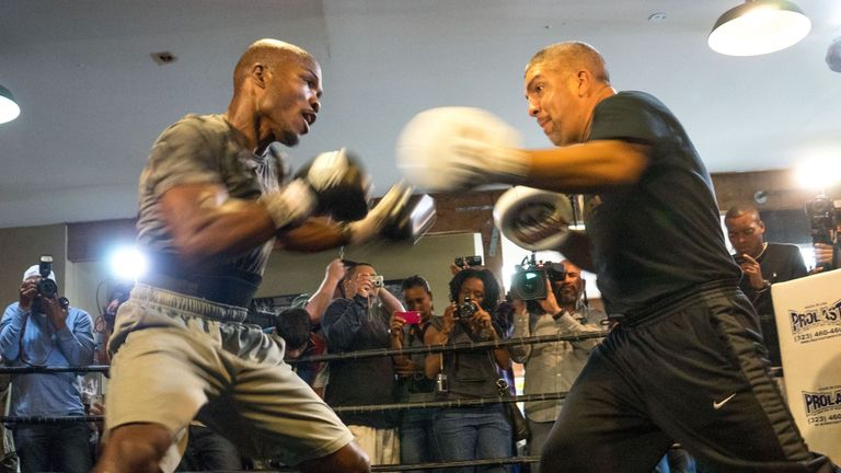 US boxer Timothy Bradley (L) and trainer Joel Diaz (R) perform during a media workout at the Fortune Gym on April 3, 2014 in Hollywood, California, in adva