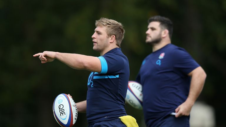 Tom Youngs issues instructions, watched by fellow hooker Rob Webber, during an England training session 