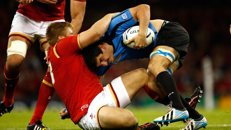 Tomas Francis tackles Jorge Zerbino during Wales' Pool A match agaisnt Uruguay