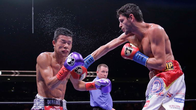 Tomoki Kameda takes a hit from Jamie McDonnell