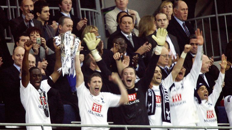 Tottenham's Robbie Keane (2nd L, front) and Ledley King (L, front) lift the trophy after winning the Carling Cup Final against Chelsea in 2008