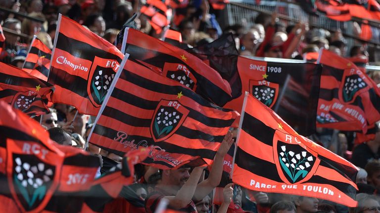 Toulon fans wave team flags 