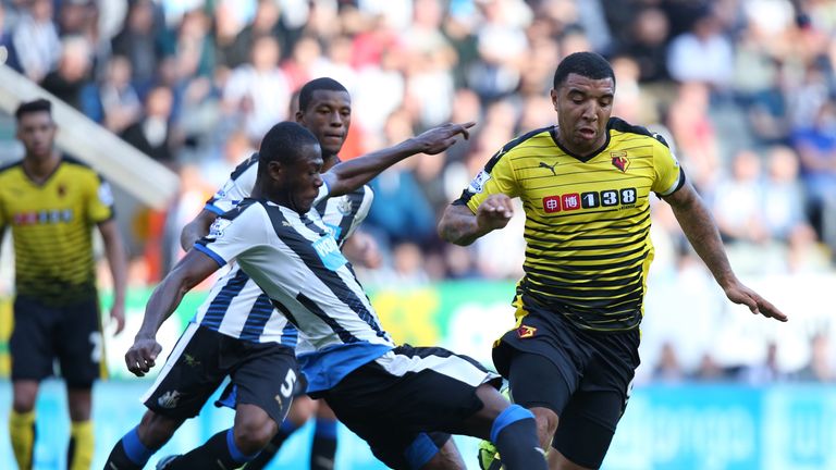 Watford's Troy Deeney goes past Chancel Mbemba of Newcastle during the Premier League match at St James' Park.