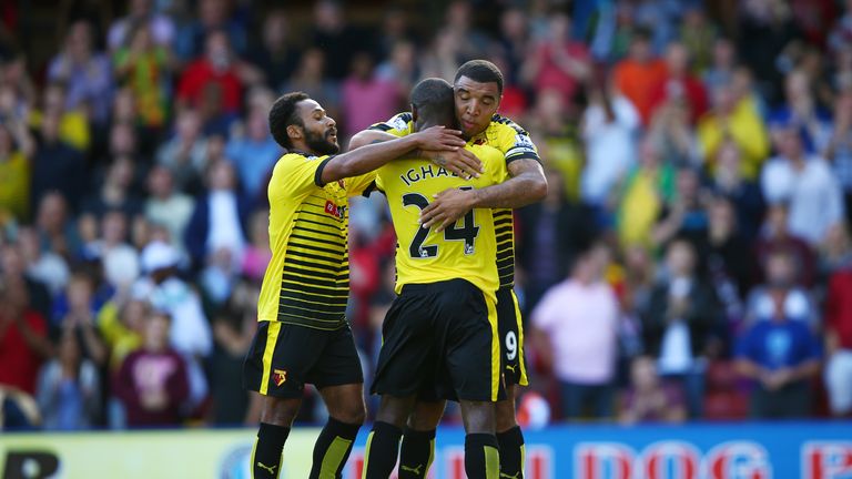 Troy Deeney congratulates goalscorer Odion Ighalo during the Barclays Premier League match between Watford and Bournemouth