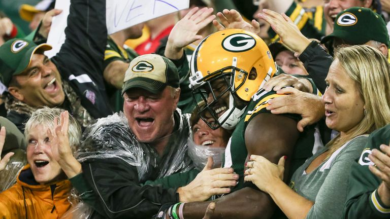 Ty Montgomery does the 'Lambeau Leap' after scoring a touchdown against Kansas