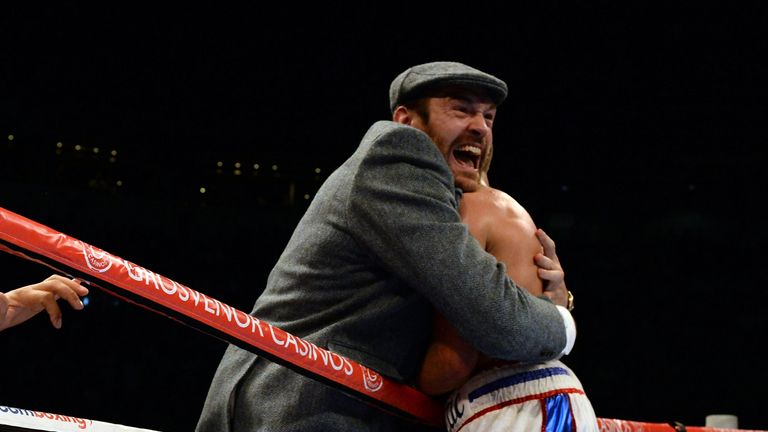 LEEDS, ENGLAND - SEPTEMBER 05:  Isaac Lowe (R) celebrates with Tyson Furry after beating Jamie Speight during their English Featherweight title boxing cont