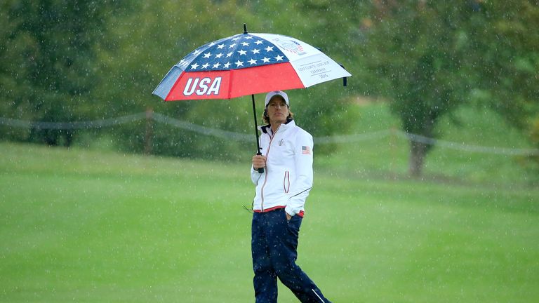 Juli Inkster the United States Team captain witching in the rain on the 12th hole during the Friday afternoon four
