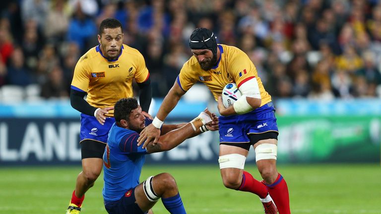 Valentin Ursache of Romania is tackled by Damien Chouly of France during the 2015 Rugby World Cup Pool D match between France and Romania