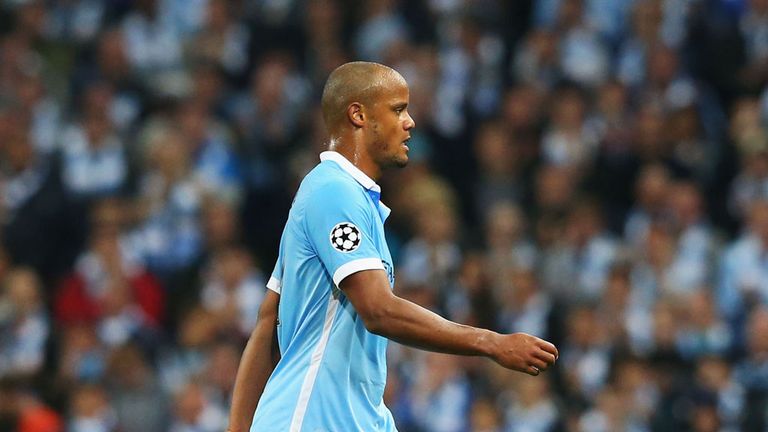 MANCHESTER, ENGLAND - SEPTEMBER 15:  An injured Vincent Kompany of Manchester City is substituted during the  UEFA Champions League Group D match between M