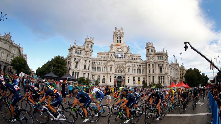 The peloton passes  during Stage 21 of the 2015 Vuelta Espana