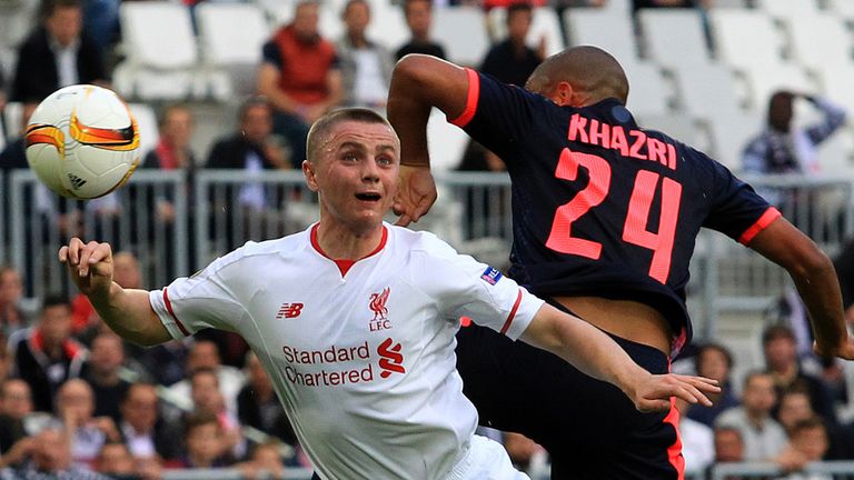 Liverpool's Jordan Rossiter, left, jumps for a header with Bordeaux's Wahbi Khazri 