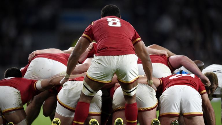 Wales No 8 Taulupe Faletau stands behind a scrum against England at Twickenham