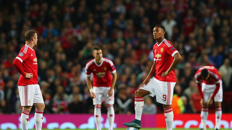 Wayne Rooney and Anthony Martial of Manchester United look dejected as Daniel Caligiuri of Wolfsburg scores