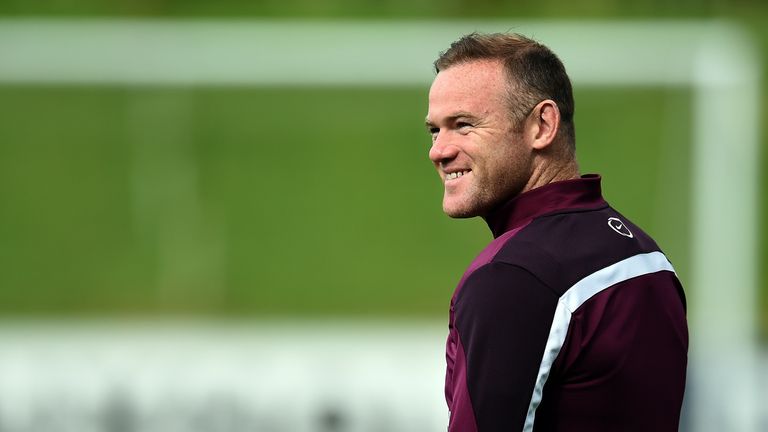 England's Wayne Rooney smiles during a team training session at St George's Park, Burton-upon-Trent