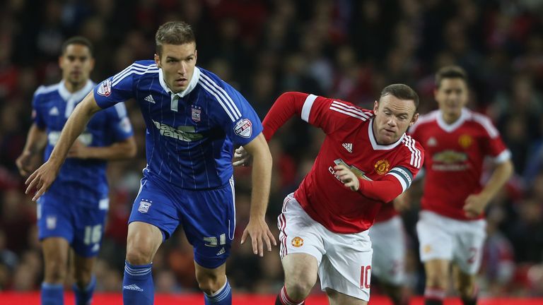  Wayne Rooney of Manchester United in action with Piotr Malarczyk of Ipswich Town