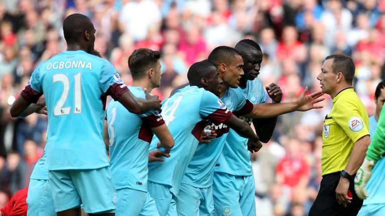 West Ham players react after Mark Noble's red card at Liverpool