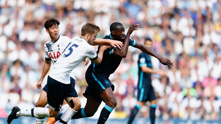LONDON, ENGLAND - SEPTEMBER 26: Yaya Toure of Manchester City and Eric Dier of Tottenham Hotspur compete for the ball