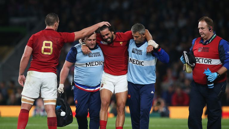 Louis Picamoles of France consoles teammate Yoann Huget of France as leaves the field injured