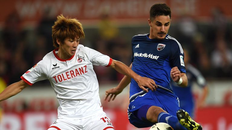 Ingolstadt's defender Benjamin H....bner and Cologne's Japanese striker Yuya Osaka (L) vie for the ball during the 