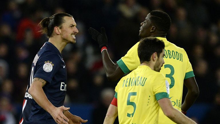 Paris Saint-Germain's Swedish forward Zlatan Ibrahimovic (L) reacts in front of Nantes' Senegalese defender Papy Djilobodji during the French L1 match