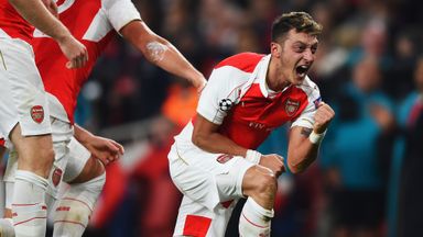Mesut Ozil celebrates his late goal against Bayern Munich