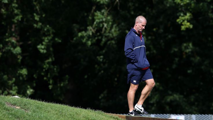  Stuart Lancaster, the England head coach walks onto the pitch during the England training session held at Pennyhill Park