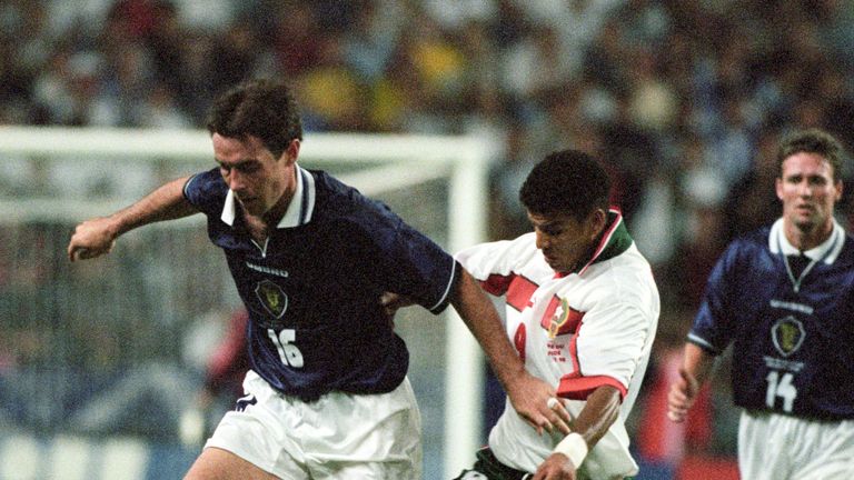 David Weir (left) is challenged by Abdeljilil Hadda against Morocco at the World Cup in France 1998