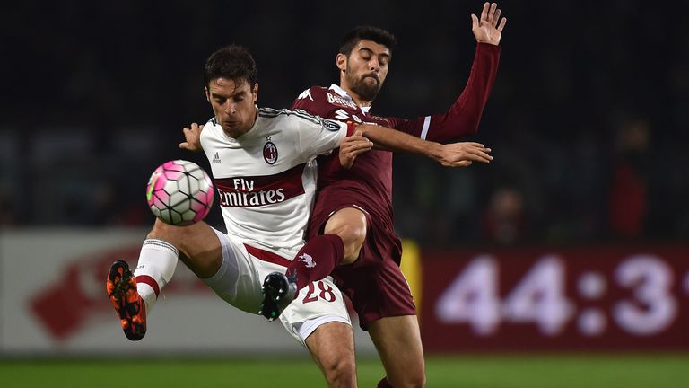 Marco Benassi (R) of Torino FC competes with Giacomo Bonaventura of AC Milan