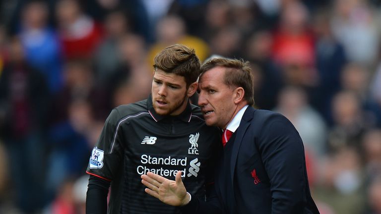 Brendan Rodgers talks to Alberto Moreno of Liverpool