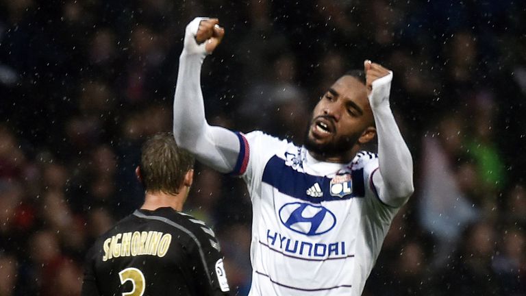Lyon's French forward Alexandre Lacazette (L) celebrates after scoring a goal 