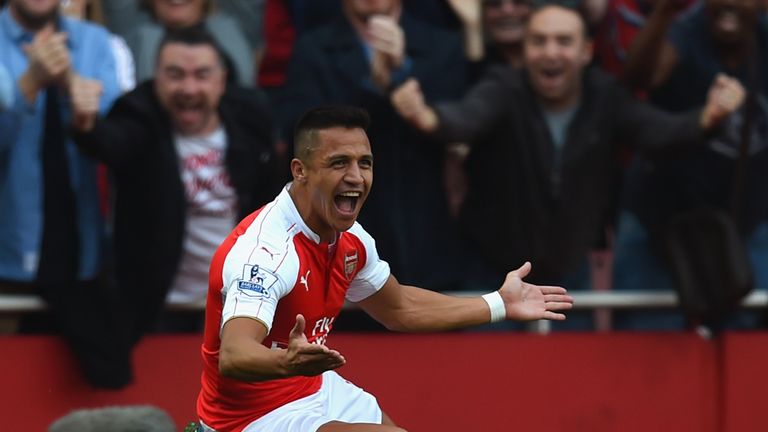 Alexis Sanchez celebrates Arsenal's third goal during the Premier League match between Arsenal and Manchester United at Emirates Stadium on October 4