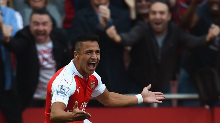 Alexis Sanchez of Arsenal celebrates scoring their third goal 