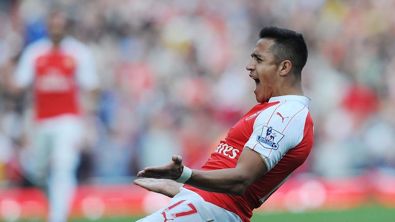 Alexis Sanchez celebrates scoring the third Arsenal goal 