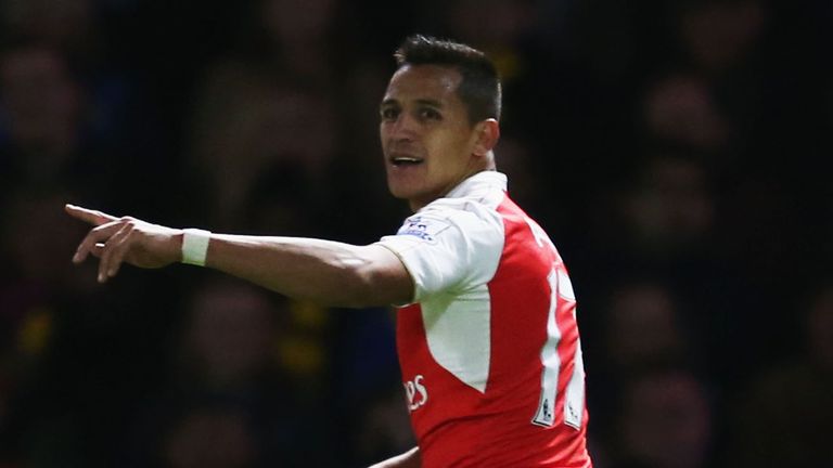Alexis Sanchez of Arsenal celebrates as he scores their first goal during the Barclays Premier League match between Watford