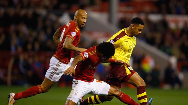 Andre Gray of Burnley battles with Ryan Mendes of Nottingham Forest 