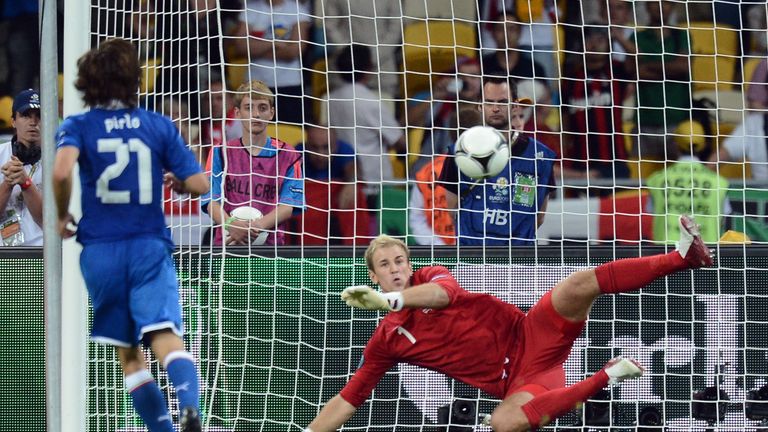 Italian midfielder Andrea Pirlo kicks and scores a penalty in the nets of England goalkeeper Joe Hart during a penalty shoot out at the Euro 2012 football