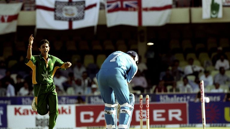 12 Apr 1999:  Azhar Mahmood of Pakistan bowls Andrew Flintoff of England in the Coca-Cola Cup match at the Sharjah CA Stadium in the United Arab Emirates. 