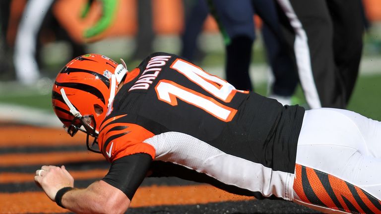 Andy Dalton #14 of the Cincinnati Bengals dives into the end zone to score a touchdown during the fourth quarter of the game 