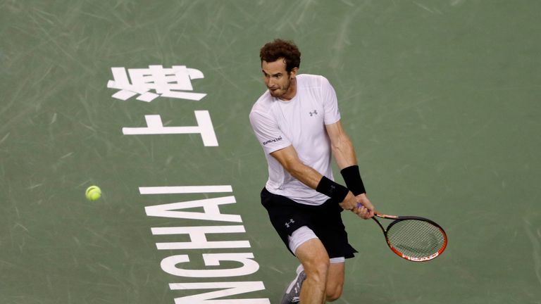 Andy Murray of Great Britain returns a shot against Novak Djokovic of Serbia in his men's singles semifinals match on day 7 