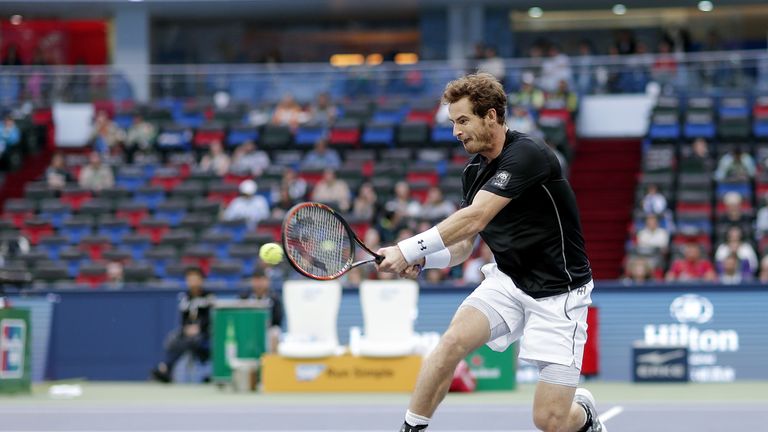  Andy Murray of Great Britain returns a shot against Steve Johnson of the United States during the men's singles second round