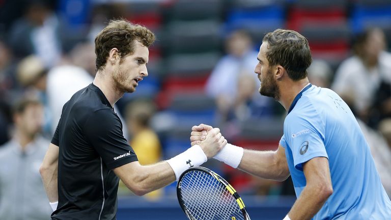 Andy Murray of Great Britain shakes hands with Steve Johnson of the United States after winning his men's singles second rou